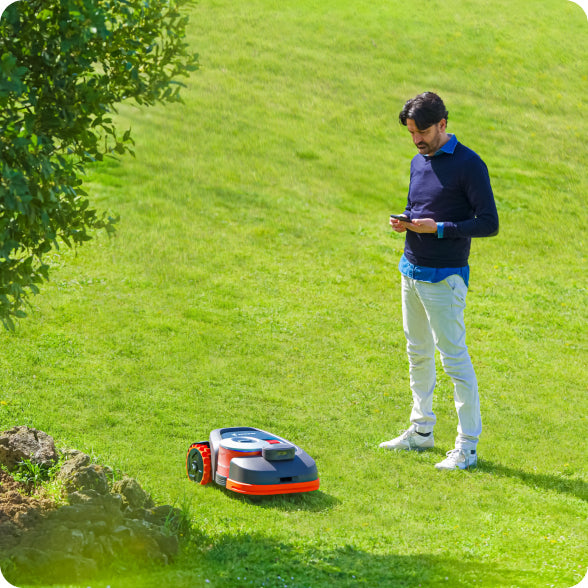 Segway Navimow i105E robot lawn mower is on the grass.