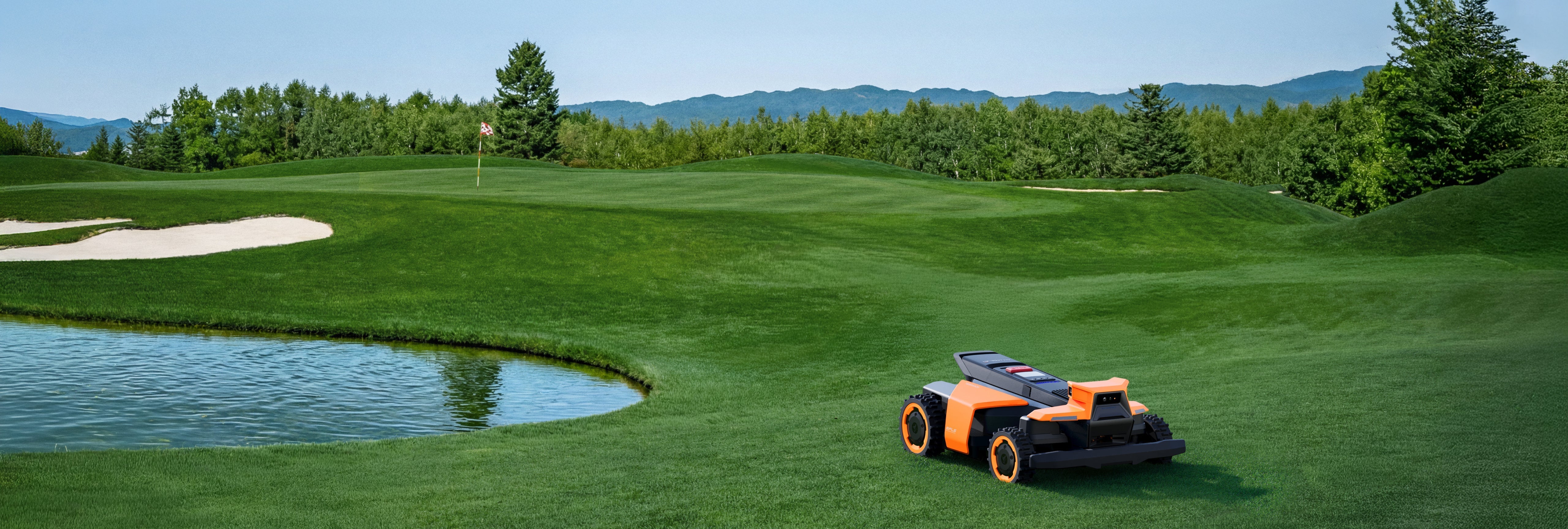Navimow i110N robot lawn mower on a green golf course.