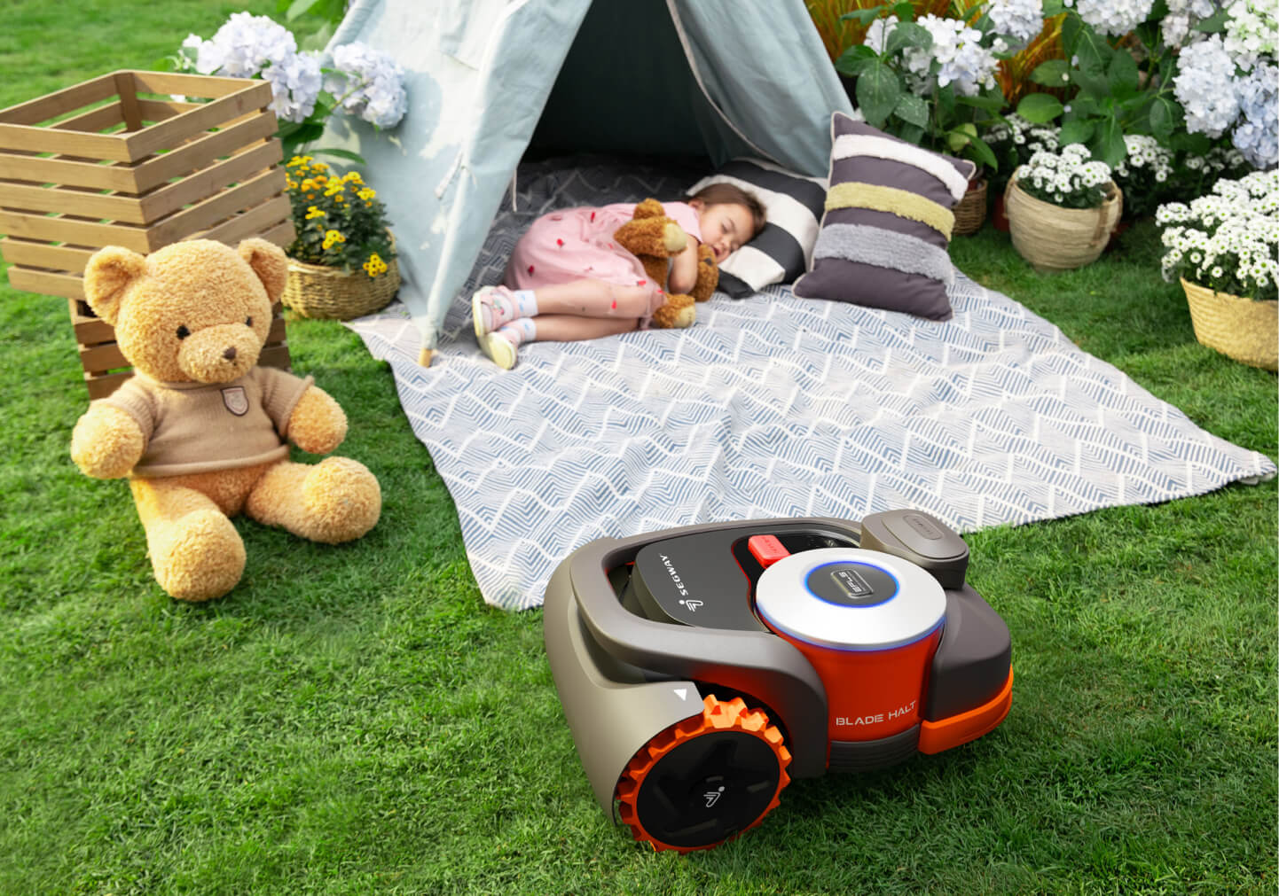 Segway Navimow i Series robot lawn mower near sleeping child.