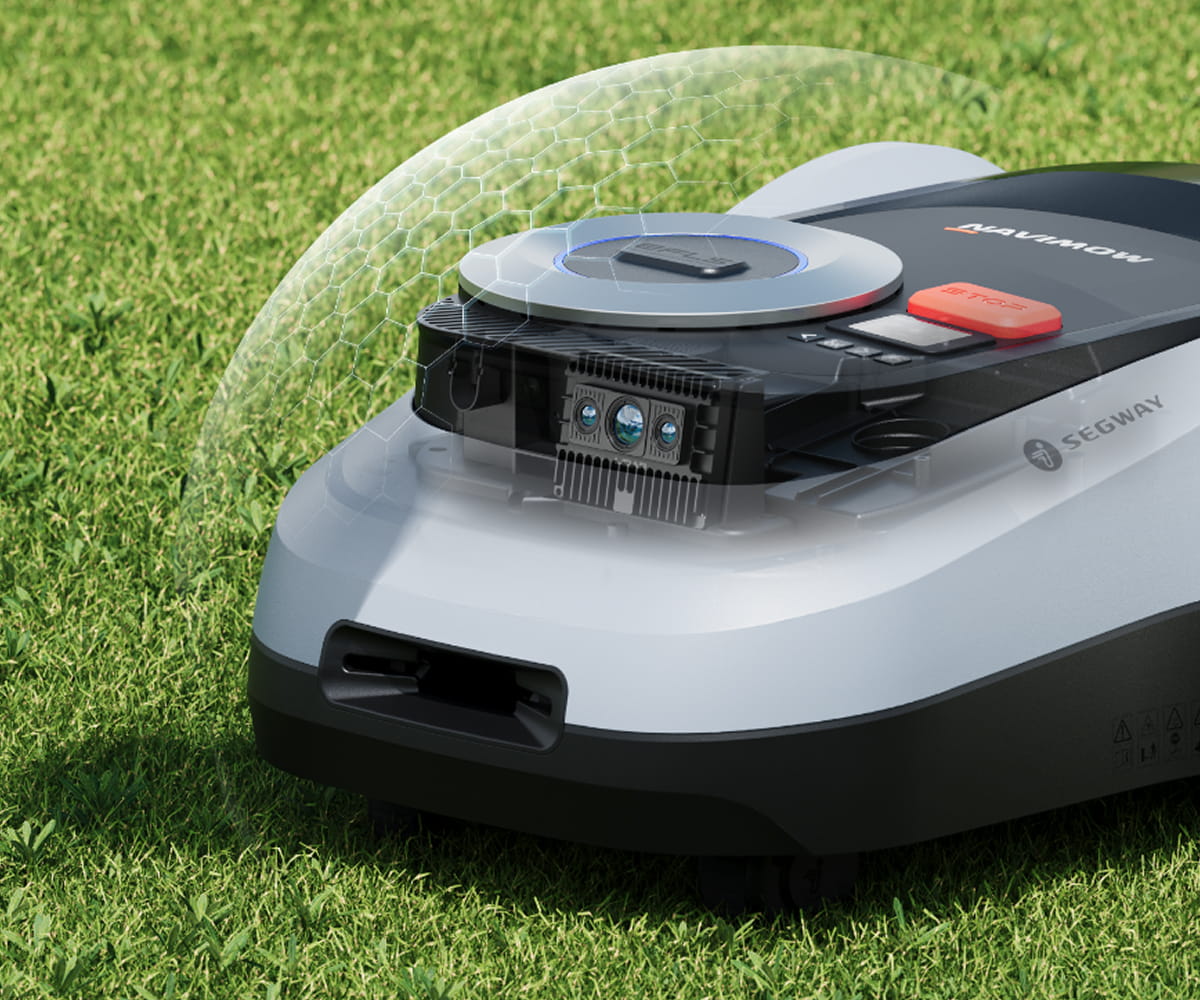 Segway Navimow robot lawn mower is cutting the green grass.