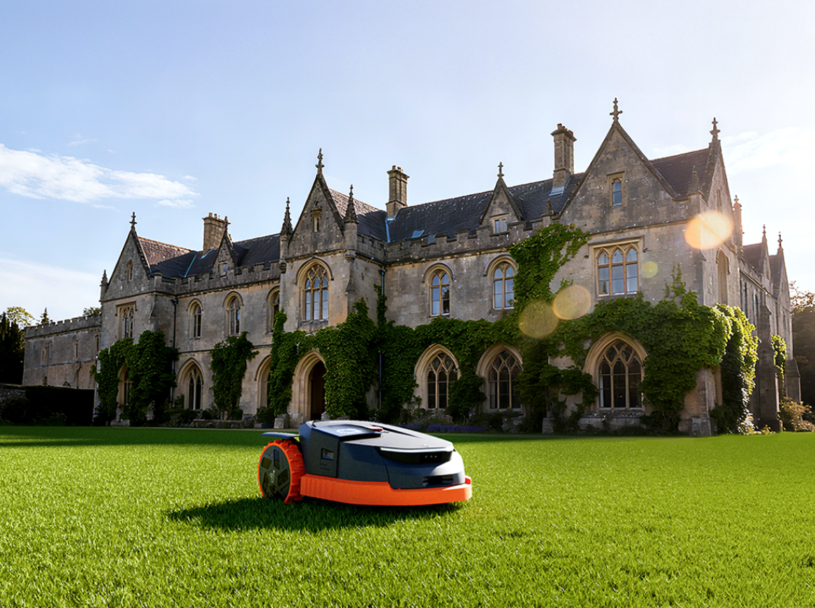 Navimow i110E robot lawn mower mows grass at the manor.