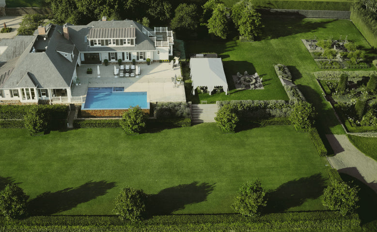 Navimow i110N robot lawn mower mows the large green lawn.