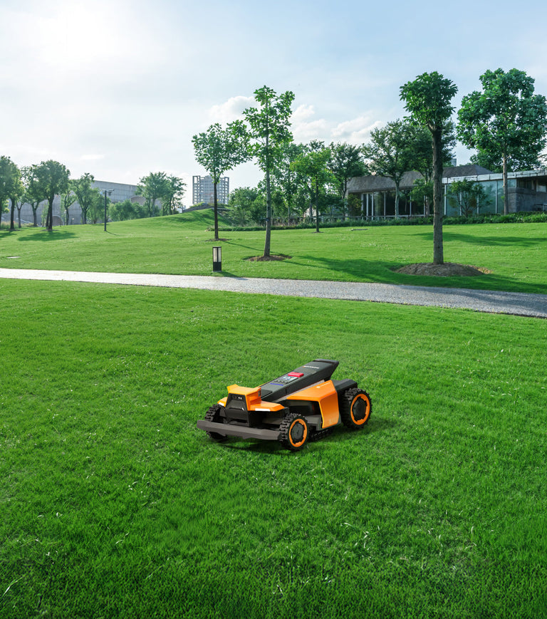 Navimow i110N robot lawn mower on a bright green field.
