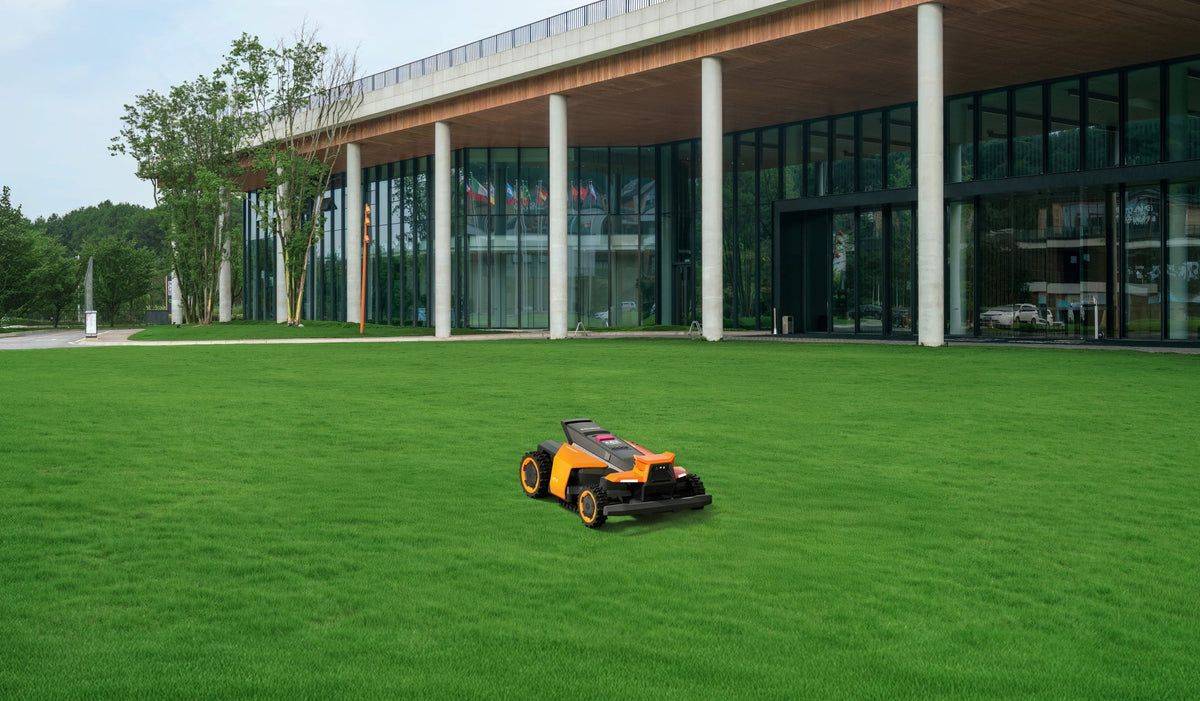 Navimow i110N robot lawn mower mows the green grass field.