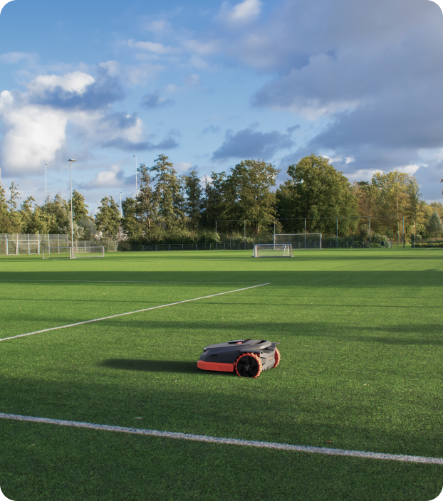 Navimow i110N robot lawn mower on the green soccer pitch.