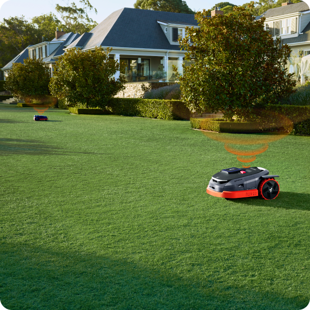 Segway Navimow i105E robot lawn mower mows a green lawn.