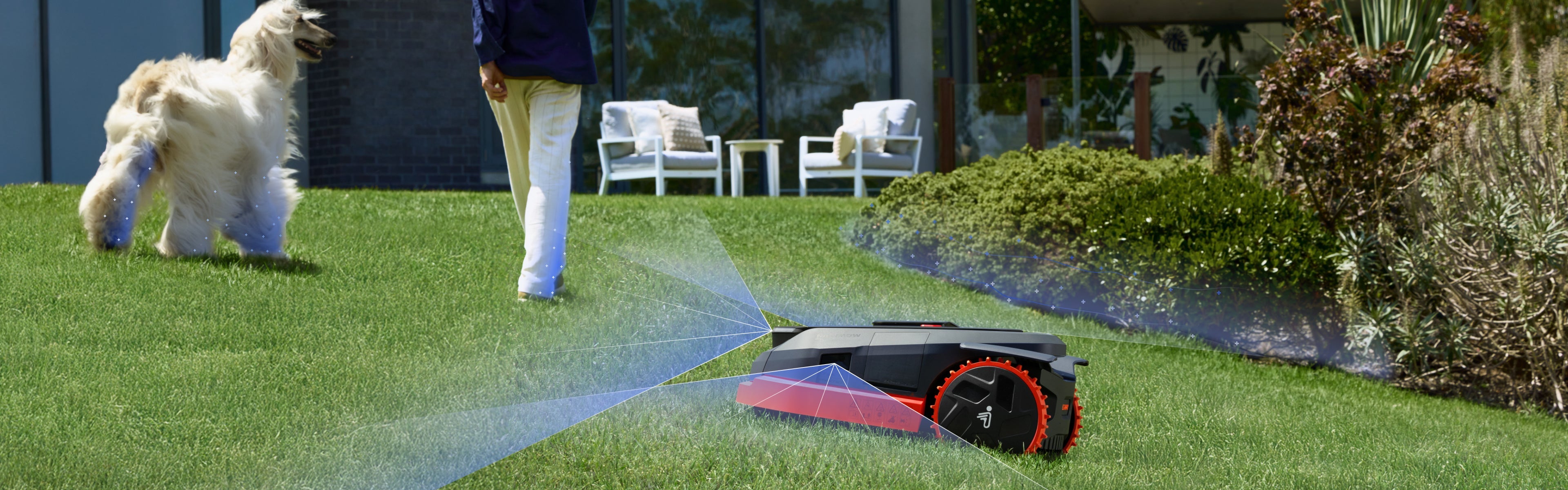 Navimow i110E robot lawn mower avoids dog and person outdoors.