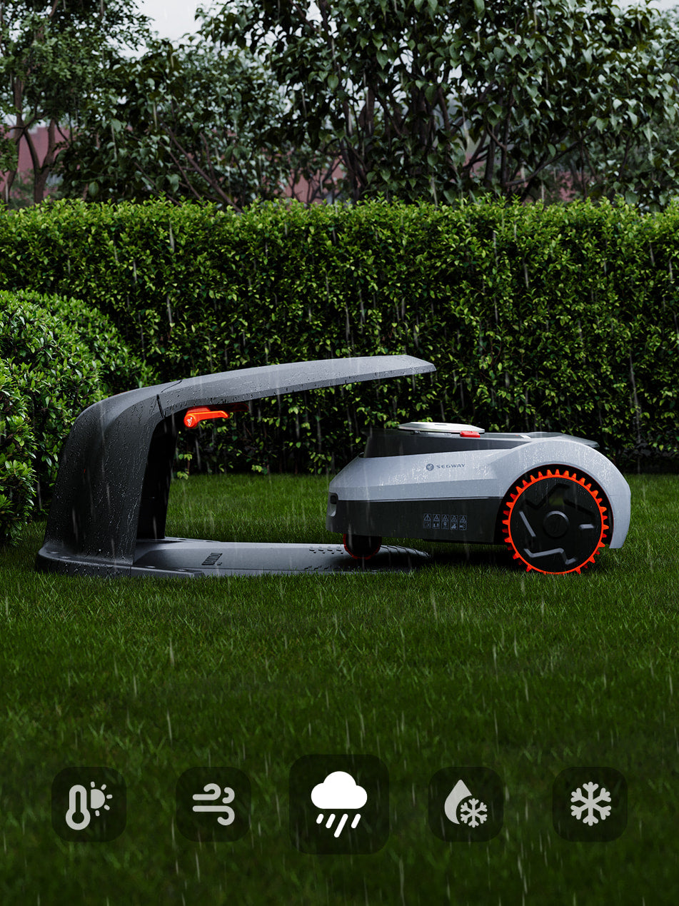 Segway Navimow i105E robot lawn mower charging in the rain.