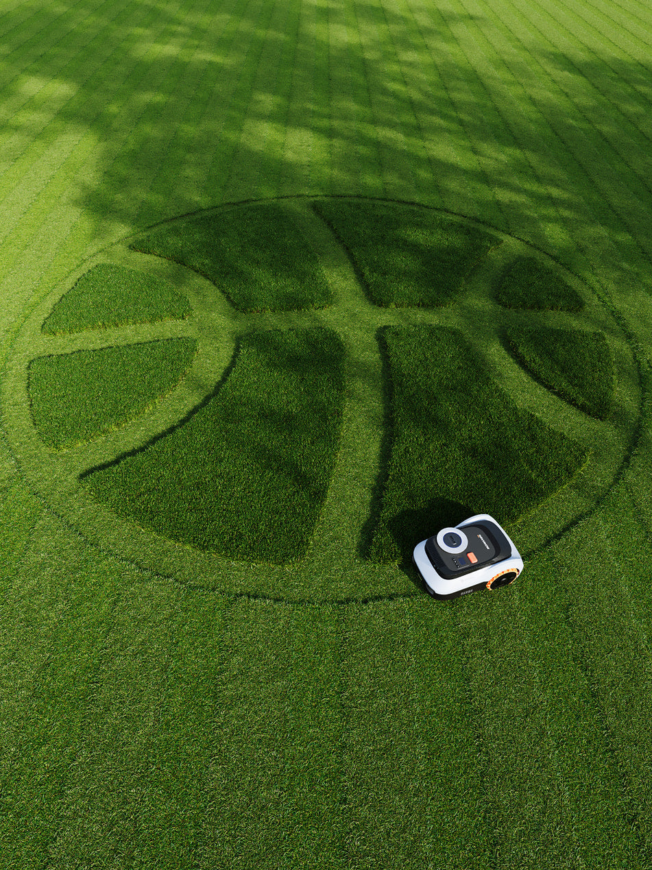 Navimow i110E robot lawn mower mows basketball pattern on grass.