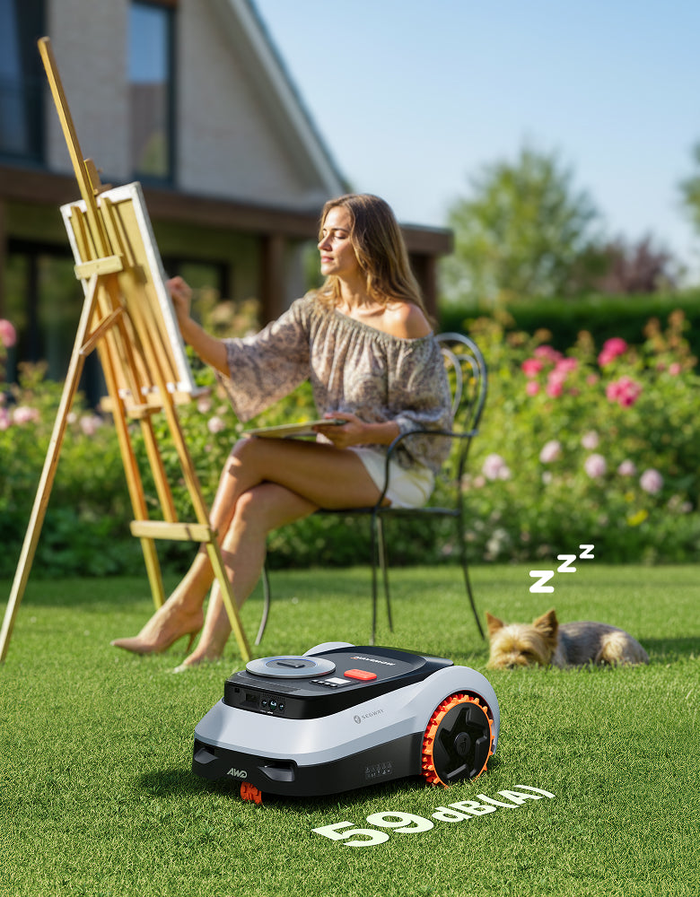 Navimow i110N robot lawn mower operates while a woman paints.