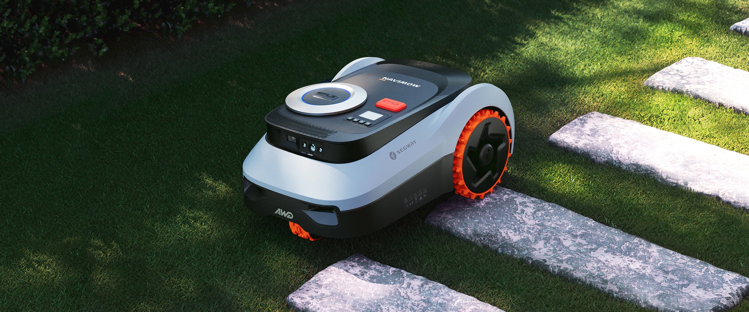 Segway Navimow robot lawn mower parked on a stone path.