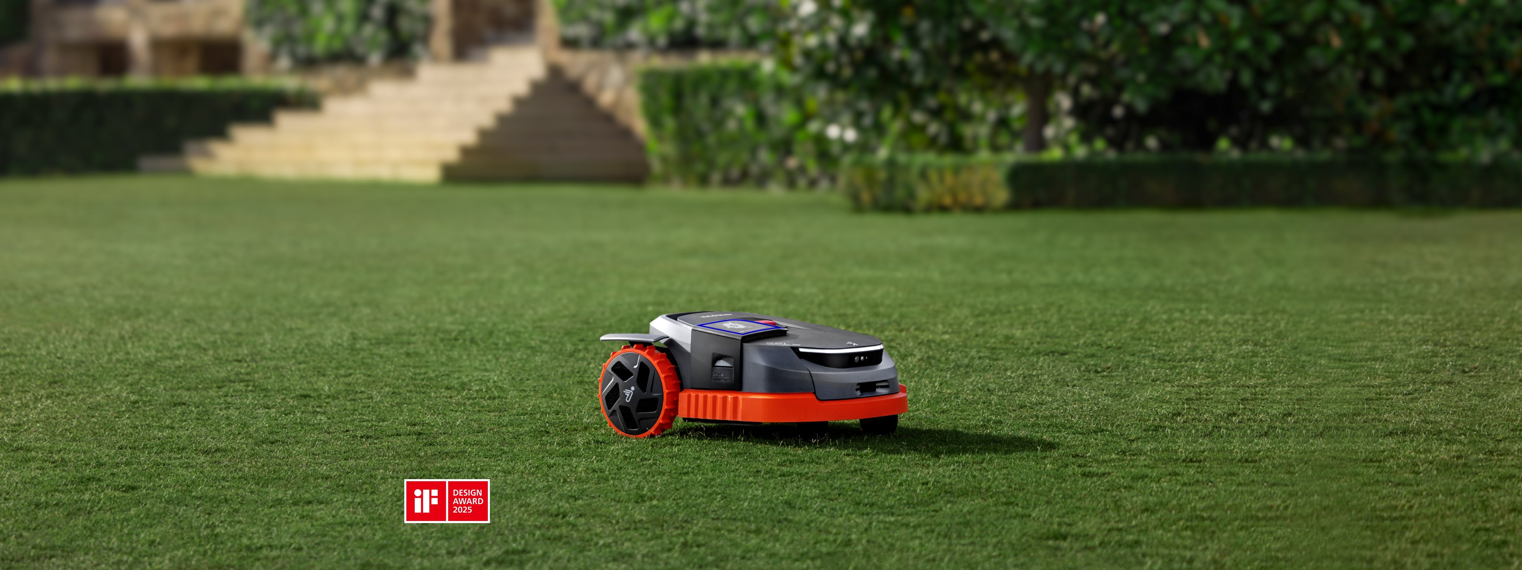 Navimow i105E robot lawn mower mows a lush green garden.