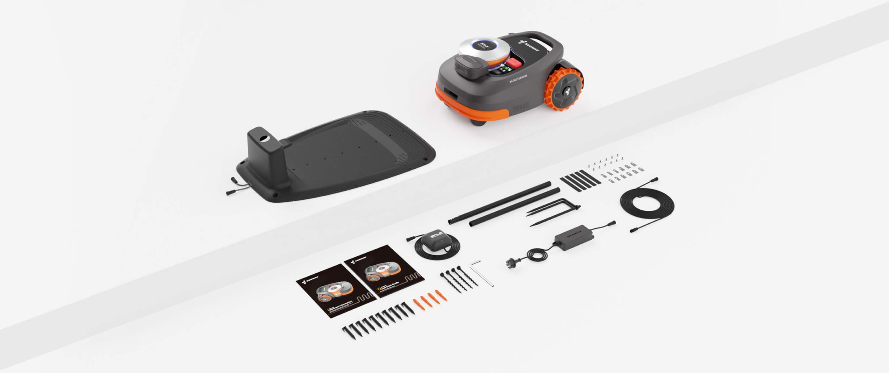 Segway Navimow robot lawn mower with charging station and various accessories.